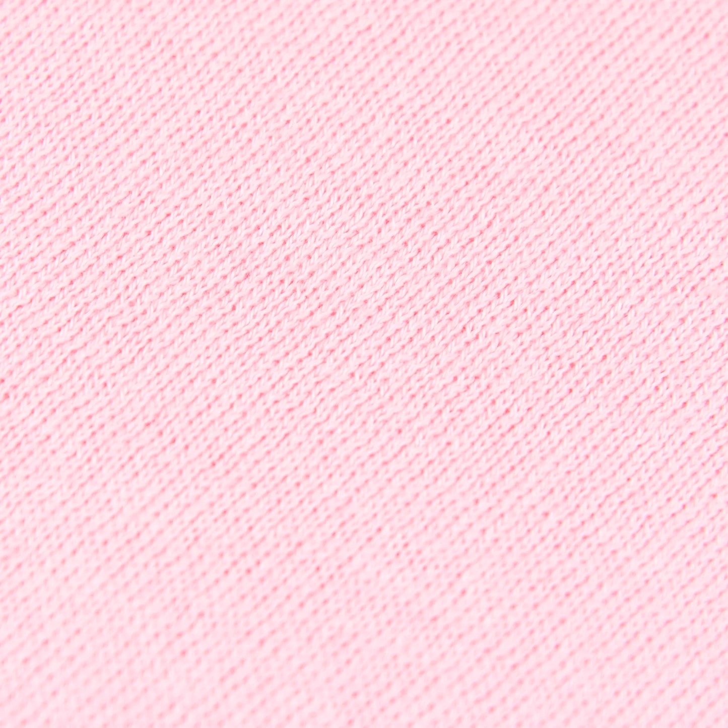 Dettagli e texture tessuto della mantellina in cashmere e cotone rosa, Made in Italy, praticità e comfort con tre diverse vestibilità per ogni esigenza.