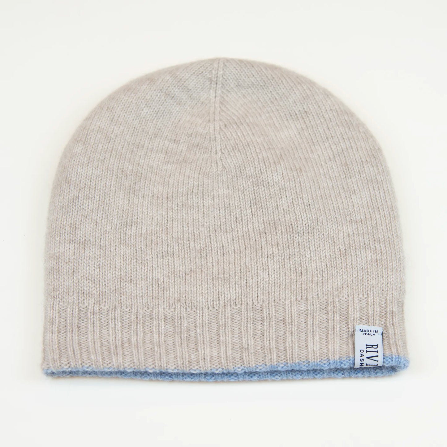 Cuffia doubleface beige e celeste in 100% Cashmere, Made in Italy. Pratica e versatile, può essere indossata con o senza risvolto. Trama rasata e pregiata manifattura per una vestibilità confortevole e di qualità.
