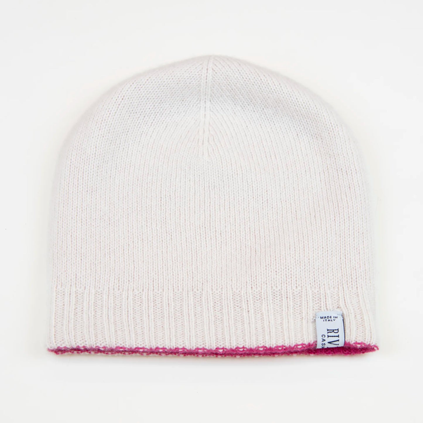 Cuffia doubleface fucsia e panna in 100% Cashmere, Made in Italy. Pratica e versatile, può essere indossata con o senza risvolto. Trama rasata e pregiata manifattura per una vestibilità confortevole e di qualità.