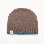 Cuffia doubleface Zaffiro e Legno in 100% Cashmere, Made in Italy. Pratica e versatile, può essere indossata con o senza risvolto. Trama rasata e pregiata manifattura per una vestibilità confortevole e di qualità.