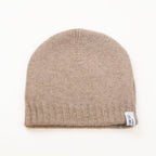 Cuffia doubleface beige e celeste in 100% Cashmere, Made in Italy. Pratica e versatile, può essere indossata con o senza risvolto. Trama rasata e pregiata manifattura per una vestibilità confortevole e di qualità.