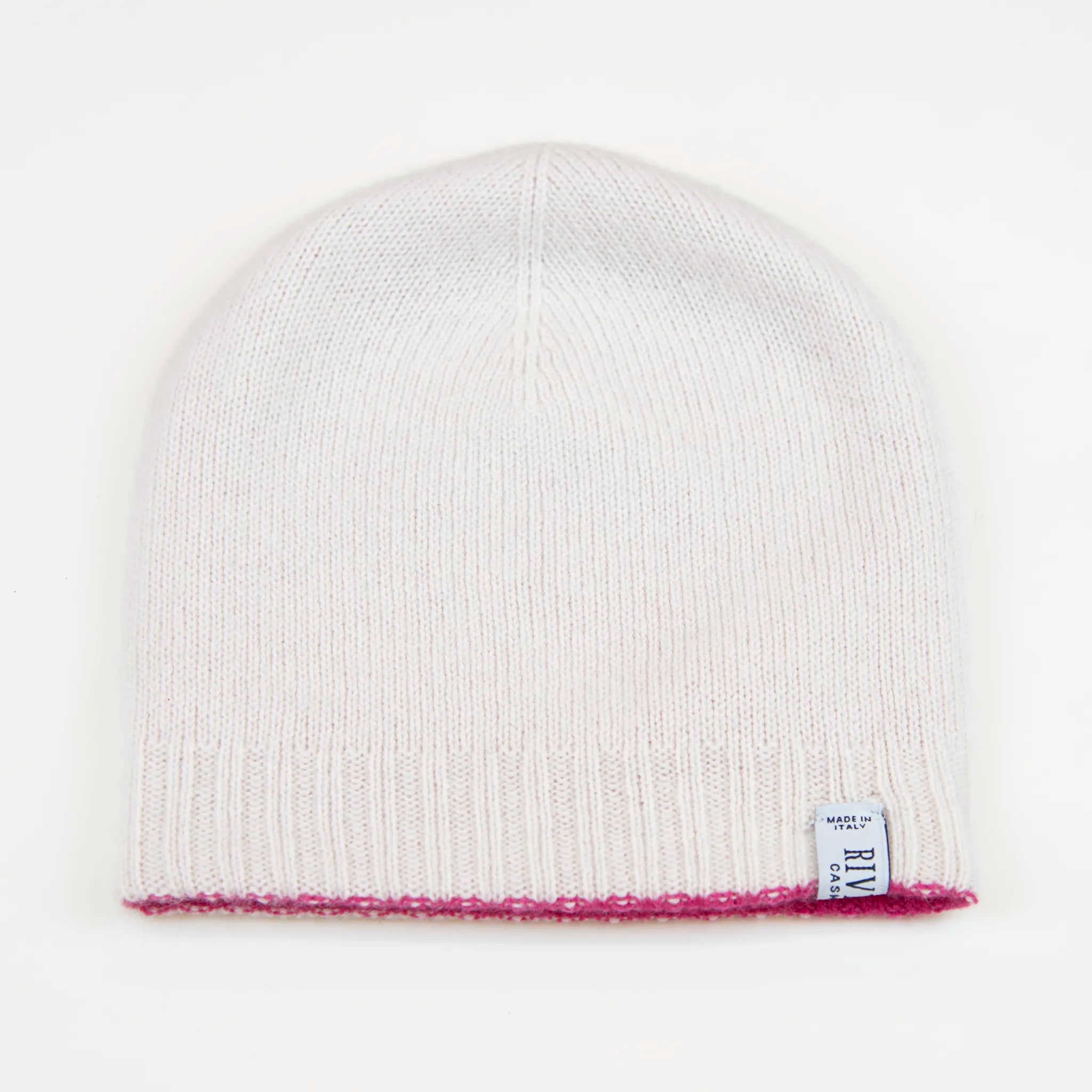 Cuffia doubleface fucsia e panna in 100% Cashmere, Made in Italy. Pratica e versatile, può essere indossata con o senza risvolto. Trama rasata e pregiata manifattura per una vestibilità confortevole e di qualità.
