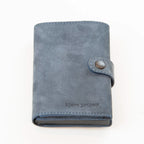 Portafoglio compatto in pelle blu Made in Italy, artigianale, con scomparto carte automatico, molla porta banconote e porta monete.