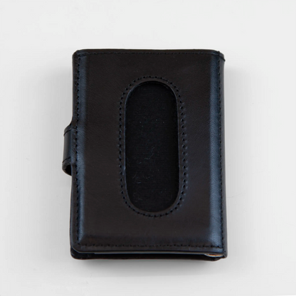 Portafoglio compatto in pelle nero, Made in Italy, artigianale, con due scomparti scorrevoli per 5/6 carte ciascuno, molla porta banconote e scomparto per monete.